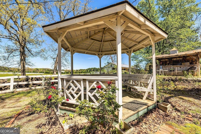 exterior space featuring a gazebo and fence