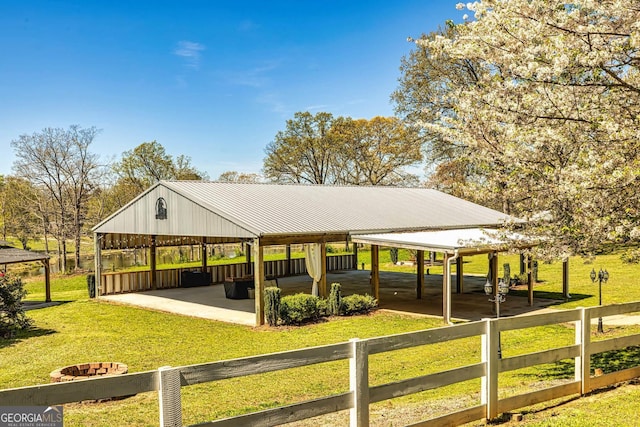 view of community with a gazebo, a yard, and fence