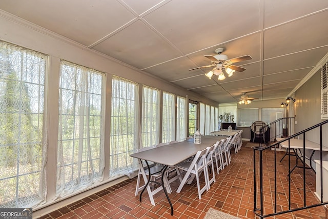 sunroom / solarium with ceiling fan