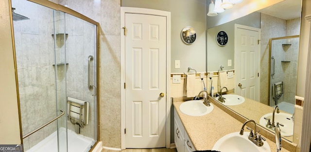 full bath featuring a sink and a stall shower