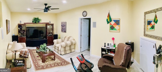 living area featuring recessed lighting, baseboards, wood finished floors, and a ceiling fan