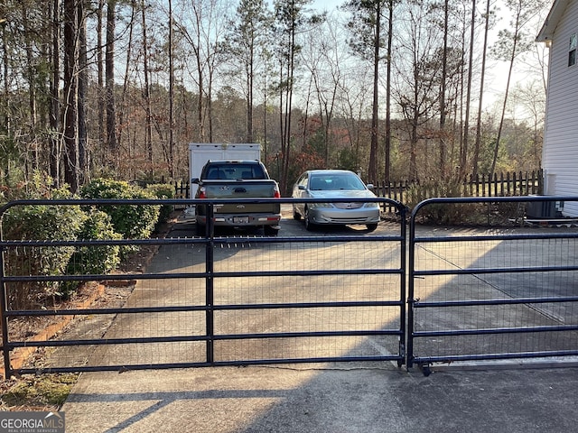 view of gate with fence