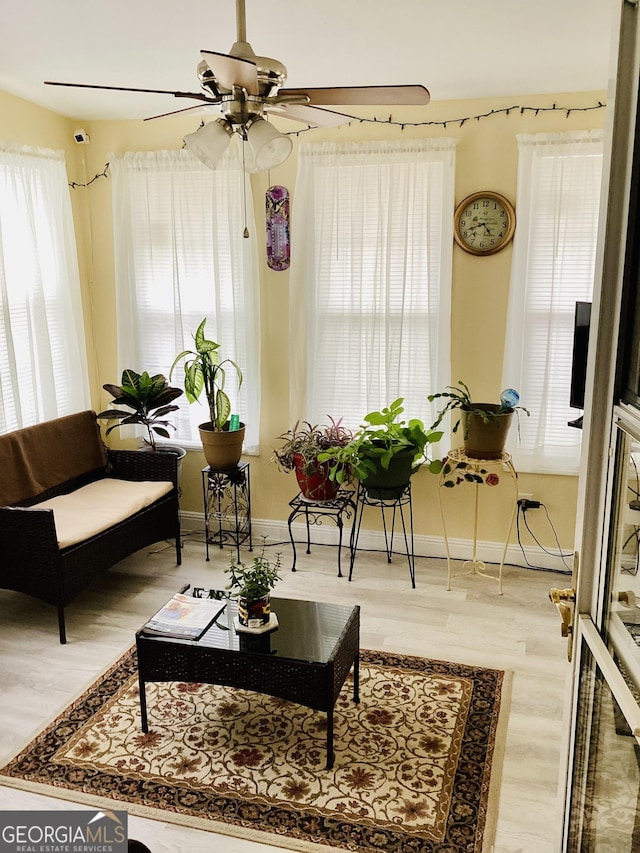 living room with wood finished floors and baseboards