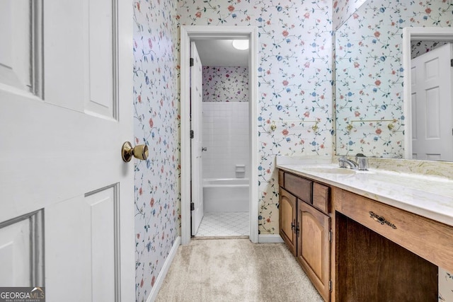 full bathroom featuring wallpapered walls, vanity, a bathtub, and a shower