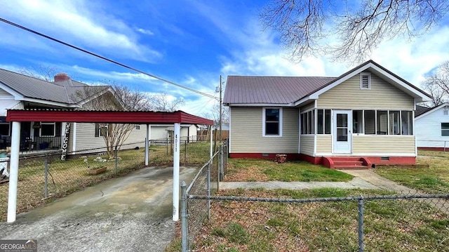 bungalow-style house with a carport, fence, and crawl space