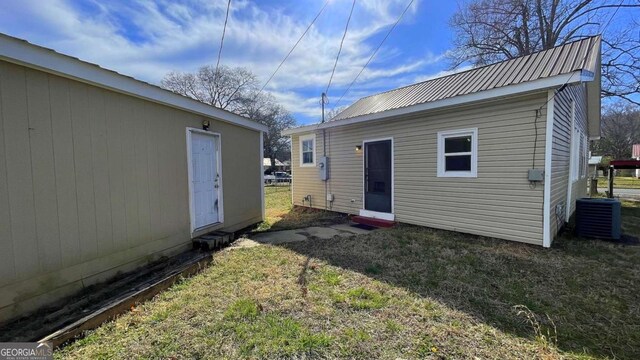 view of outbuilding with an outbuilding and fence
