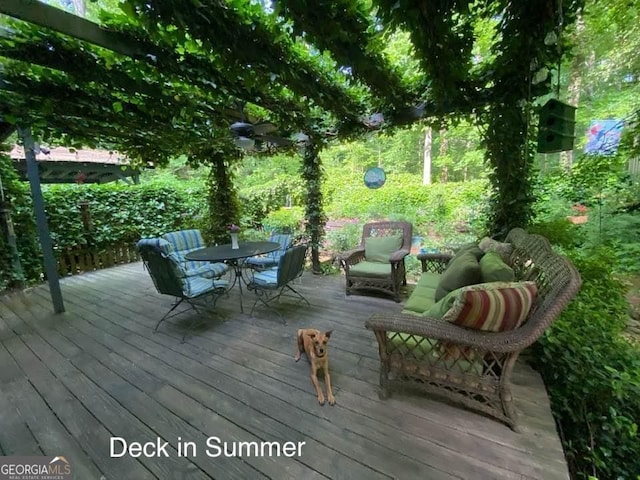 wooden deck with outdoor dining space