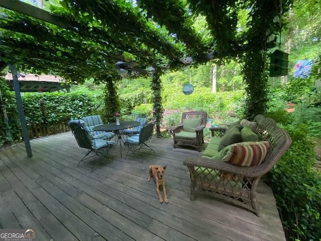 wooden terrace with outdoor dining area