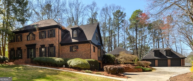 1435 Jay Ct, Snellville, GA 30078 - view of side of property featuring driveway, an outbuilding, brick siding, a garage, and a yard