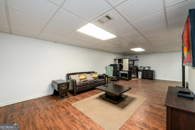 1435 Jay Ct, Snellville, GA 30078 - living room featuring baseboards, visible vents, a drop ceiling, and wood finished floors