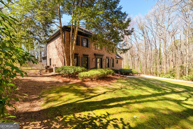 1435 Jay Ct, Snellville, GA 30078 - view of front of property featuring brick siding and a front yard