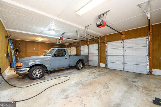 1435 Jay Ct, Snellville, GA 30078 - garage featuring a garage door opener