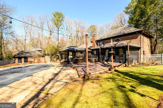 1435 Jay Ct, Snellville, GA 30078 - view of yard featuring an outbuilding, fence, and a gazebo