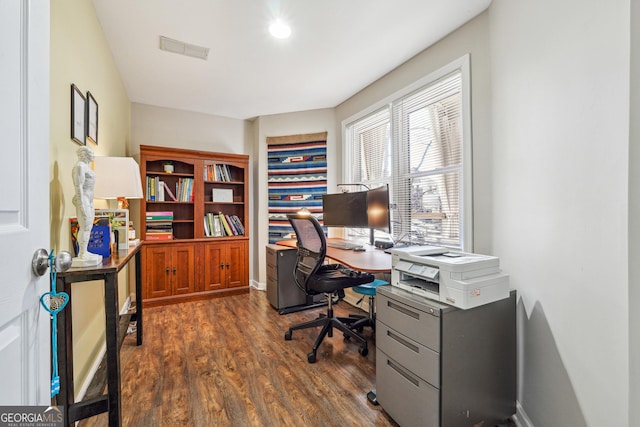 office space featuring dark wood finished floors and visible vents