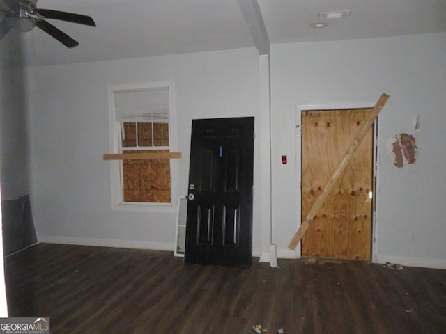 entrance foyer with a ceiling fan, wood finished floors, visible vents, and baseboards