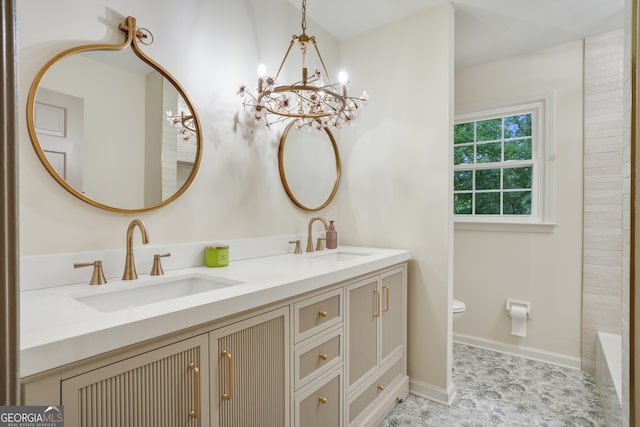 full bathroom featuring a sink, baseboards, toilet, and double vanity