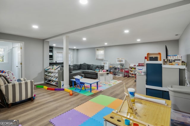 rec room with recessed lighting, baseboards, and wood finished floors