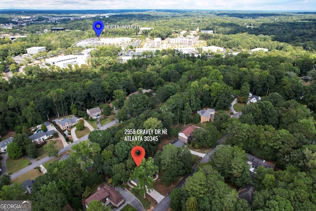 drone / aerial view featuring a forest view