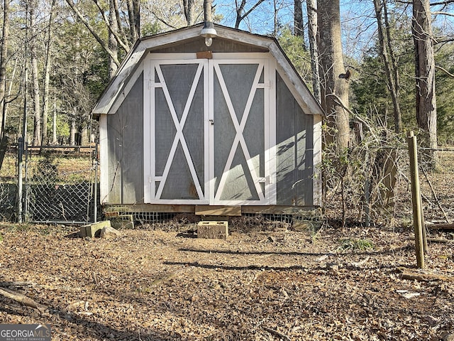 view of shed with fence