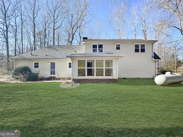 back of property with a lawn and a chimney