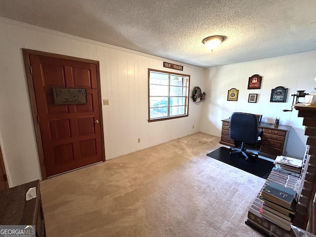 home office with carpet floors and a textured ceiling