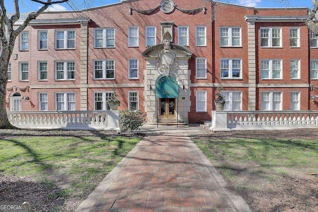 view of front of property featuring brick siding