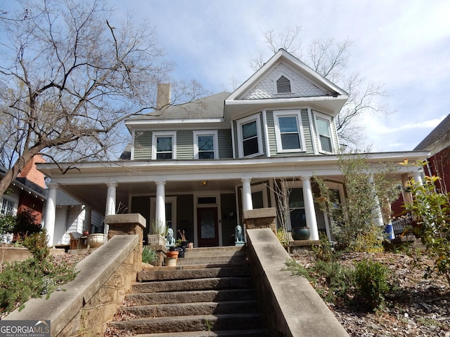 victorian home with covered porch and stairs