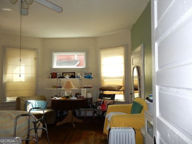 sitting room featuring wood finished floors and a ceiling fan