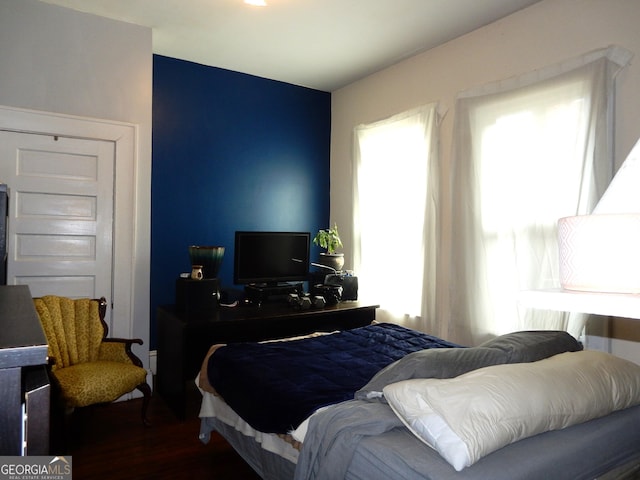 bedroom with wood finished floors