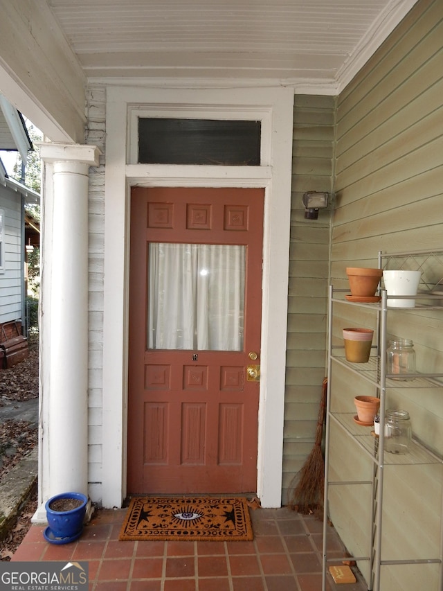 doorway to property featuring a porch