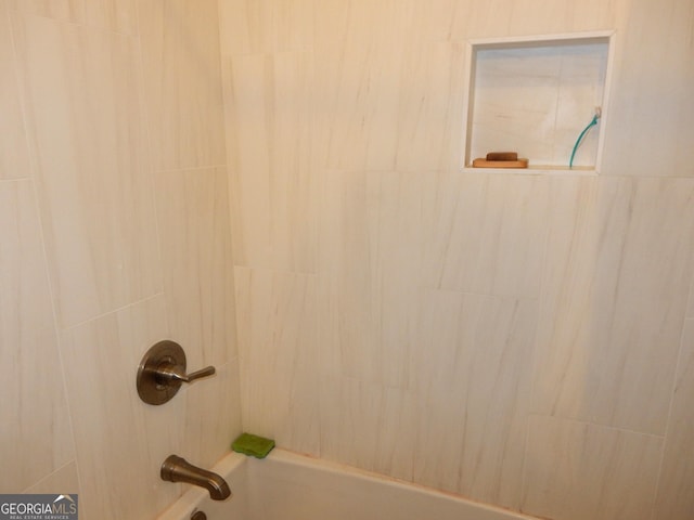 details featuring washtub / shower combination