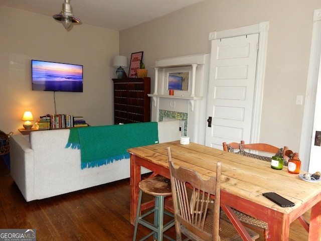 dining space featuring wood finished floors