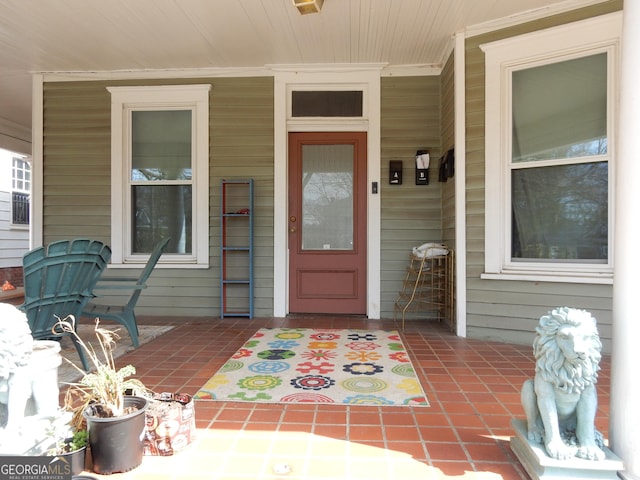 property entrance featuring covered porch