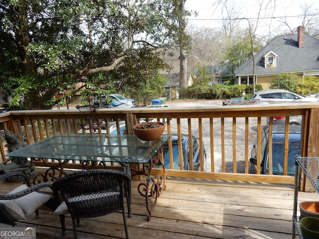 wooden deck with outdoor dining area