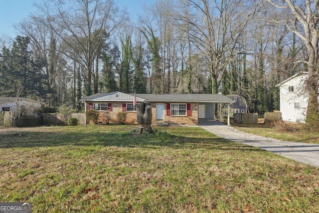 ranch-style home featuring brick siding, driveway, a front lawn, and fence