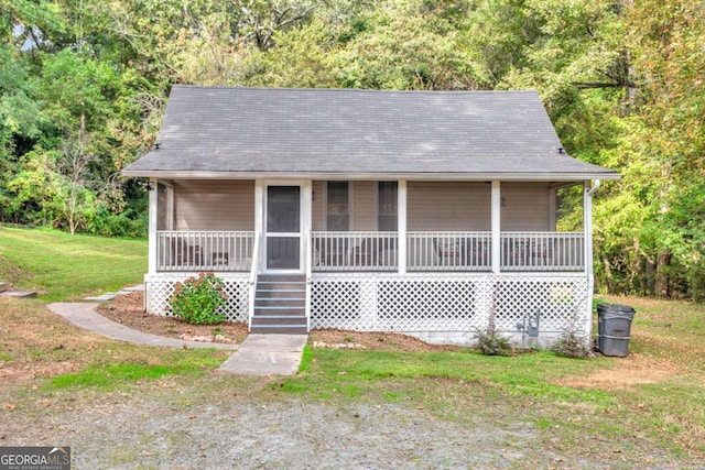 view of front of home with a porch and a front yard