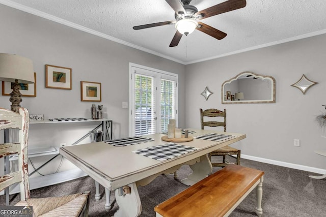 dining room featuring baseboards, a textured ceiling, carpet, and ornamental molding