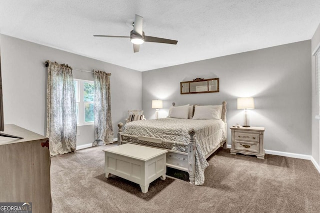 bedroom with a textured ceiling, a ceiling fan, baseboards, and carpet floors