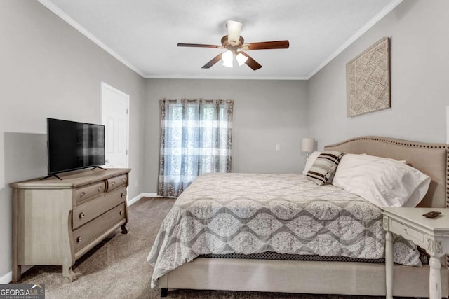 carpeted bedroom featuring a ceiling fan, baseboards, and ornamental molding