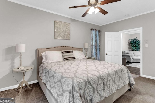 bedroom featuring a ceiling fan, crown molding, carpet, and baseboards