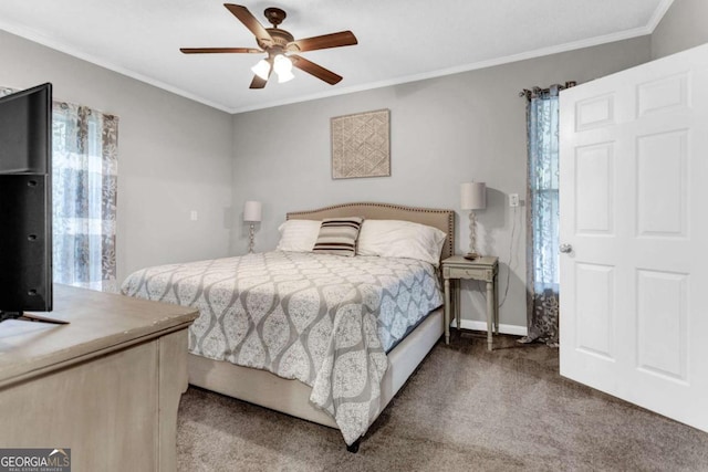 carpeted bedroom featuring ceiling fan, baseboards, and ornamental molding