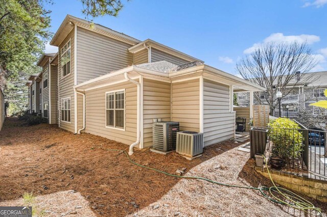 view of home's exterior with cooling unit