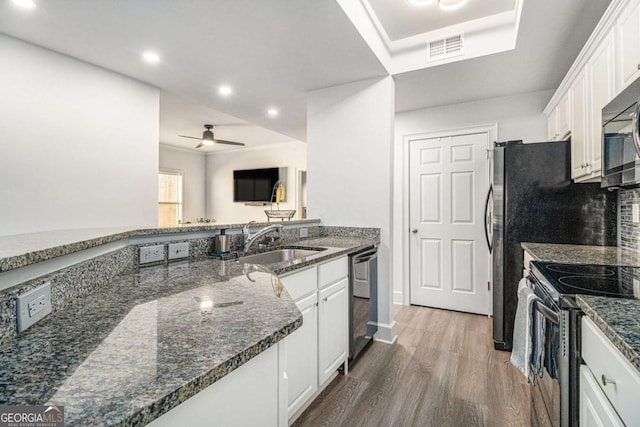 kitchen featuring visible vents, white cabinetry, stainless steel electric range, a sink, and dishwasher