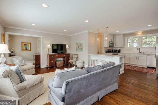 living room with recessed lighting, ornamental molding, and dark wood-style flooring