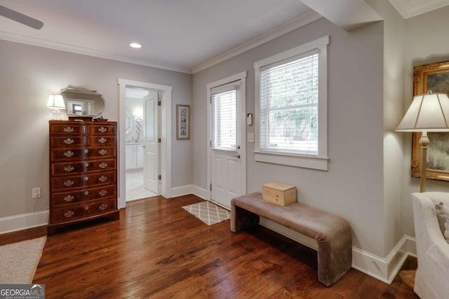 entryway with recessed lighting, wood finished floors, baseboards, and ornamental molding