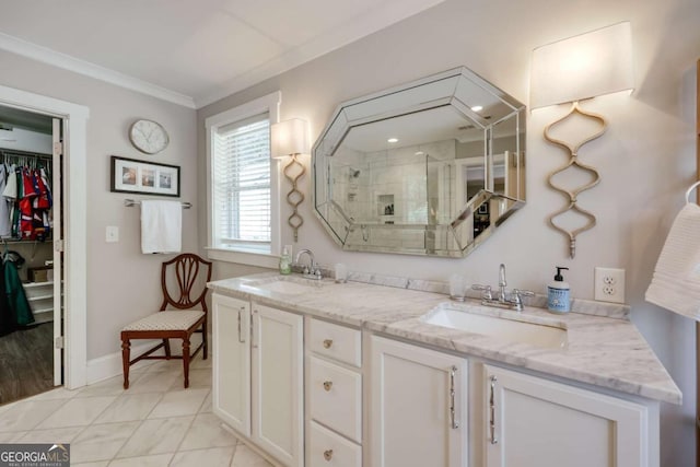 full bath with crown molding, double vanity, a stall shower, and a sink