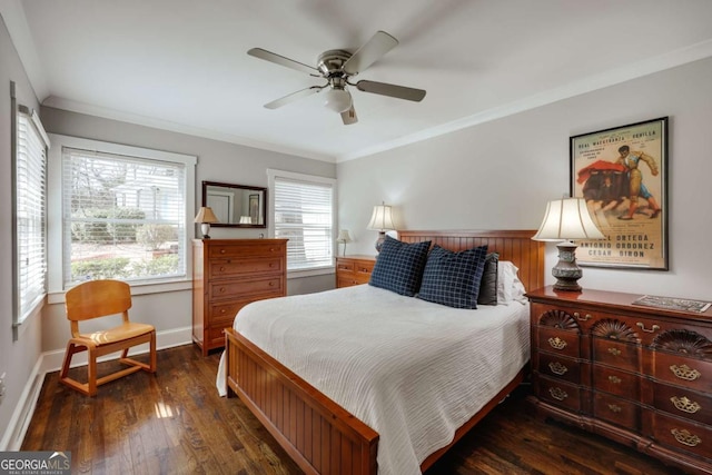 bedroom featuring ceiling fan, baseboards, wood-type flooring, and ornamental molding