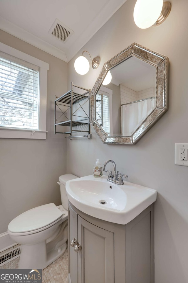 full bathroom featuring visible vents, toilet, vanity, and tile patterned flooring