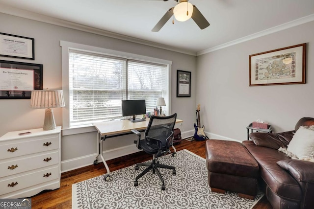 office area with baseboards, dark wood finished floors, a ceiling fan, and ornamental molding