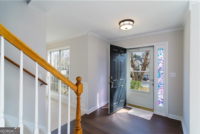 entryway featuring stairway, baseboards, ornamental molding, and dark wood-style flooring